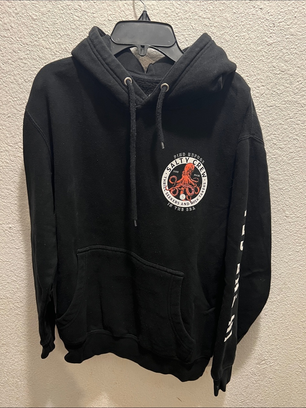 Salty Crew Black Hoodie with Orange Octopus Chest Graphic